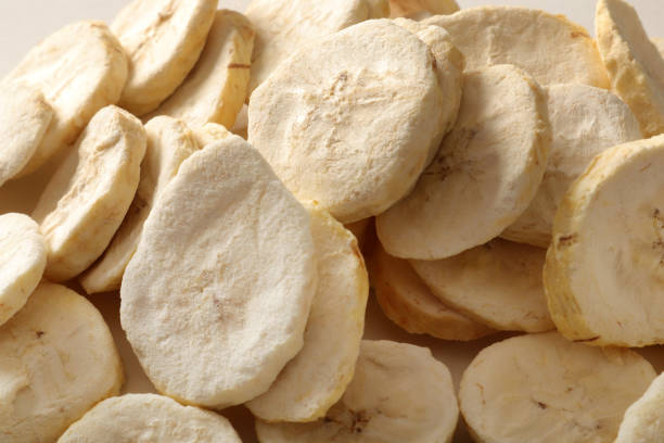 Pile of sweet dehydrated banana slices.