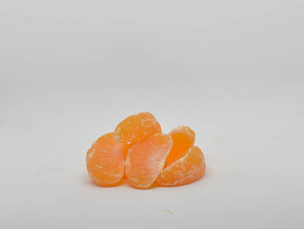 Ripe mandarin with leaves close-up