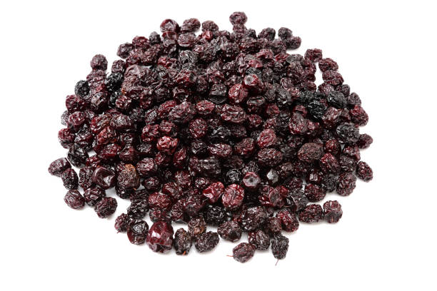 Dried black plum on white background